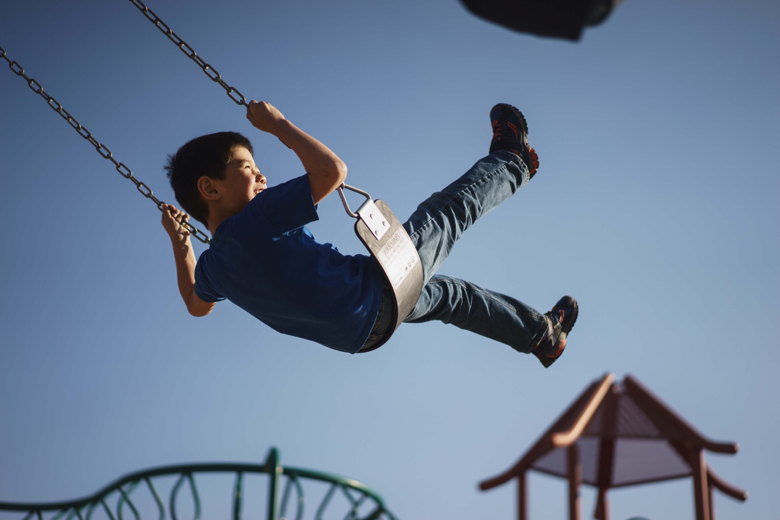 little boy on a swing